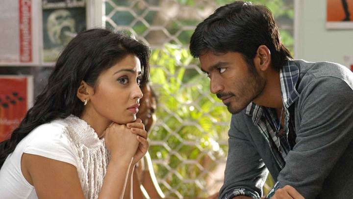 Shriya Saran N Dhanush Sitting Pose In Kutty Movie